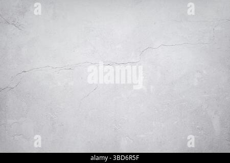 Abstrakter grauer Beton mit feiner Textur und Rissen Stockfoto