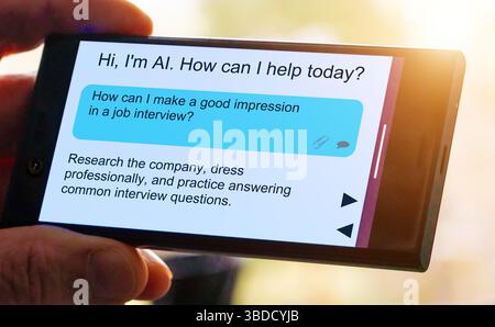 Frage zur künstlichen Intelligenz auf dem Smartphone-Bildschirm. Wie kann ich bei einem Vorstellungsgespräch einen guten Eindruck hinterlassen? Stockfoto