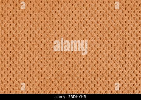 Einfarbiger orangefarbener Veloursbezug, flauschiger Jacquard mit Makro, geschlossener Muster Webstruktur Hintergrund, Textiloberfläche aus Stoff. Hintergrundbild, Backdr Stockfoto