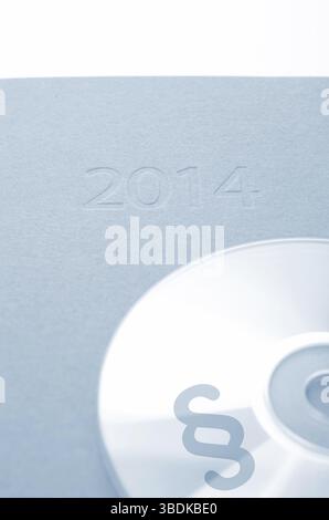 CD mit einem Absatz Symbol auf einen Kalender 2014 Stockfoto