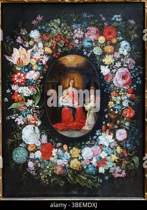 Das Gemälde von Frans Francken II. Aus dem Jahr 1620, „Jungfrau und Kind umgeben von musikalischen Engeln in einer Blumengirlande“, zeigt wunderschön die Jungfrau Maria mit Kind, umgeben von engelhaften Musikern in einem Blumenarrangement. Stockfoto