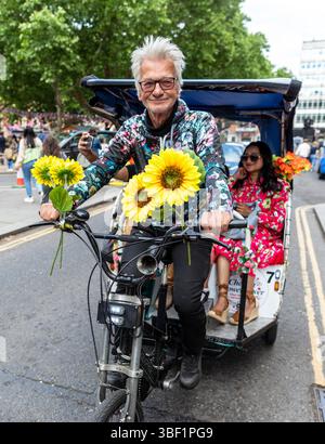 Rikscha-Fahrer in der Kings Road während des Chelsea Flower Festival Stockfoto