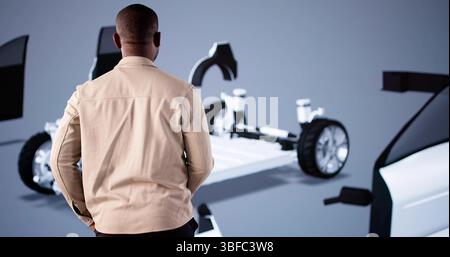 Amerikanischer Ingenieur mit PC zur Montage von Autos in der Automobilindustrie Stockfoto