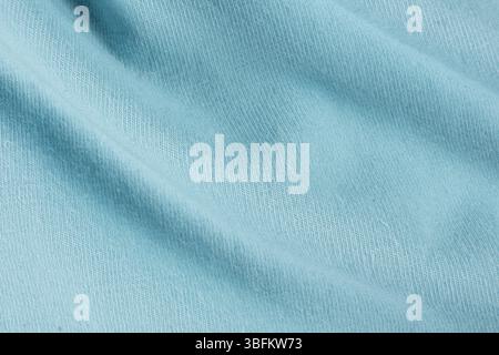 Makrostruktur aus blauem Baumwollgewebe mit leichtem Spandex. Stockfoto