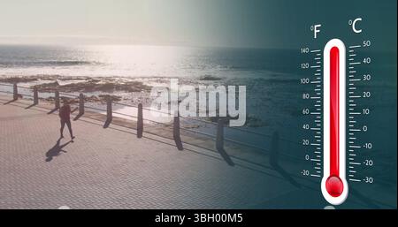 Bild des Digitalthermometers über der Meereslandschaft Stockfoto