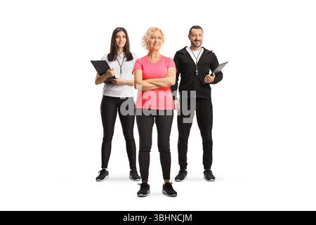 Männliche und weibliche persönliche Trainer mit einer Reifen Frau isoliert auf weißem Hintergrund Stockfoto