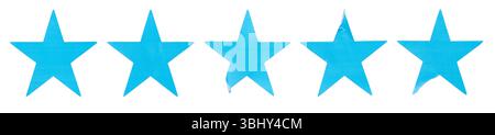 Ein Satz blauer, sternförmiger Papieraufkleber, isoliert auf weißem Hintergrund. Stockfoto