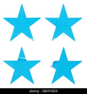 Ein Satz blauer, sternförmiger Papieraufkleber, isoliert auf weißem Hintergrund. Stockfoto