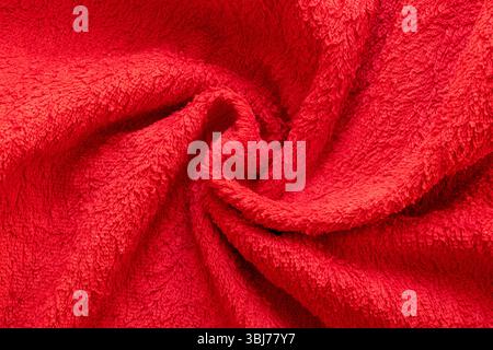 Frotteebrotes Handtuch in Spiralnähe, weiche Textur aus Stoff mit Schlaufen, kuscheliges Baumwollmaterial Stockfoto