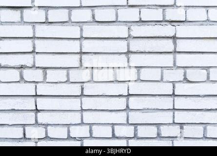 Weißer Backsteinmauerhintergrund mit einzigartigem Muster. Ein hochauflösendes Bild einer weißen Ziegelwand mit einem unverwechselbaren Muster, das ein klares und Stockfoto