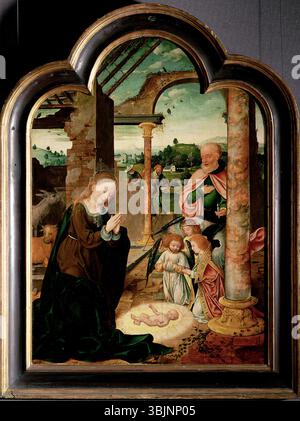 Joos van Cleves „die Geburt Christi“ (um 1520) stellt die Krippe mit dem Christkind in einer Krippe dar. Die Ölmalerei auf Tafeln ist reich an Details und spiegelt den Ansatz der frühen Renaissance in der religiösen Ikonographie wider. Stockfoto