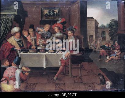 Das Gemälde „der reiche Mann und Lazarus“ aus der Schule von Frans Francken I. zeigt die biblische Geschichte des reichen Mannes und des Bettlers Lazarus. Das Kunstwerk, das im flämischen Stil geschaffen wurde, beschäftigt sich mit den Themen Reichtum, Armut und Jenseits. Es ist ein Ölgemälde auf Holz. Stockfoto