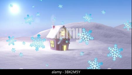 Kleines Haus, das Licht durch Fenster auf einem schneebedeckten Hügel unter schwebenden Schneeflocken erleuchtet Stockfoto