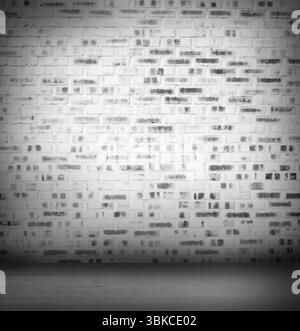 Weiß lackierte Ziegelwand wird in einem flachen Design-Innenstudio mit Holzboden gezeigt Stockfoto