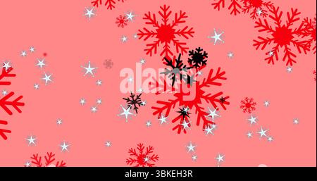 Rote und schwarze Schneeflockenformen vor pinkfarbenem Hintergrund mit kleinen weißen Starbursten Stockfoto