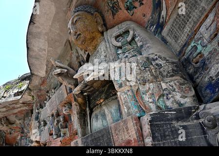 Chongqing, China: Buddha-Status unter den komplizierten Dazu Baodingshan Felsenschnitzereien Stockfoto
