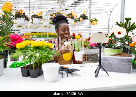 Frau filmt ein Pflanzentraining Stockfoto