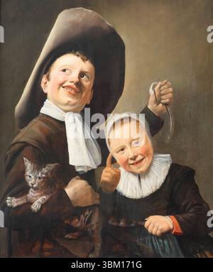 „A Boy and a Girl with a Cat and an Ael“ von der niederländischen Golden Age Malerin Judith Leyster in der National Gallery, London, Großbritannien Stockfoto