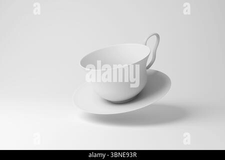 Weiße klassische Teetasse und eine Untertasse in der Luft auf weißem Hintergrund. Illustration des Begriffs Teekultur und Porzellan Stockfoto