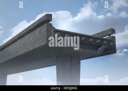 Die Betonüberlaufsäule steigt in flacher Bauweise und zeigt Träger mit Anschlussblöcken Stockfoto