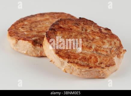 Stapel 2 Burger Patties gestapelter Grill Stockfoto