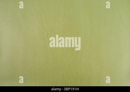 Grüne Makrolederstruktur, brauner Hintergrund aus Kunstleder. Brauner, strukturierter Lederhintergrund. Stockfoto