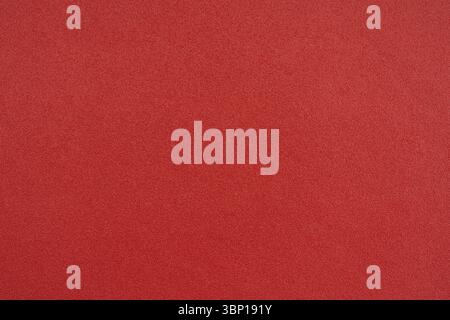Rotes Makroleder, braune Hintergrundstruktur aus Kunstleder. Brauner, strukturierter Lederhintergrund. Stockfoto