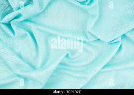 Türkisfarbene Sportbekleidung Stoff Fußballtrikot Textur abstrakter Hintergrund. Stockfoto
