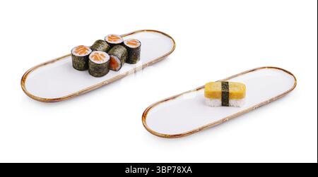 Essen, Eine Sushi-Platte zeigt eine Auswahl an lebhaften Brötchen mit Fisch und Gemüse sowie ein unverwechselbares Block-Sushi-Stück. Die Einstellung hebt den Wert m hervor Stockfoto