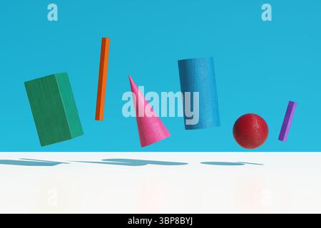 3D-Rendering farbenfroher geometrischer Holzformen, die auf blauem Hintergrund mit sanften Schatten schweben, perfekt für verspielte und kreative Projekte Stockfoto