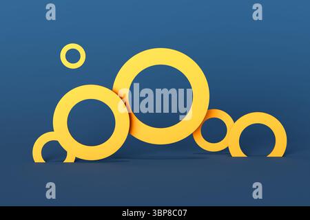 Abstrakte Komposition aus gelben Ringen unterschiedlicher Größe auf blauem Hintergrund, die ein modernes und minimalistisches Konzept schafft Stockfoto