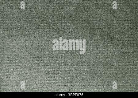 Grüner, strukturierter Hintergrund, der den Rahmen füllt, geeignet für Designprojekte und bietet viel Kopierraum Stockfoto