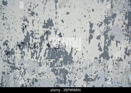 Mehrere Schichten weißer, grauer und schwarzer Farbstruktur abgelöst Stockfoto