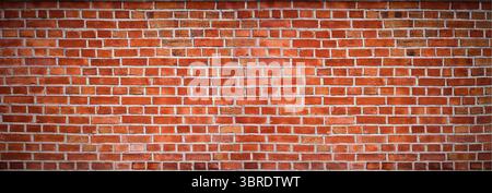 Roter Backsteinmauerhintergrund, weites Panorama des Mauerwerks Stockfoto