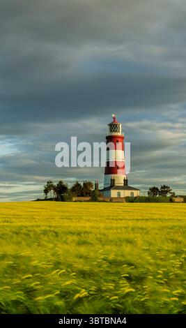 Happisburgh Lighthouse mit Blick nach Norden auf Golden Hour East Anglia Norfolk England Großbritannien Stockfoto
