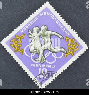 Gestempelte Briefmarke, gedruckt von der Mongolei, die Running, Olympische Sommerspiele 1960 - Rom, um 1964 zeigt. Stockfoto