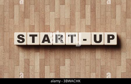 START-UP Holzwortblock Würfel mit Laminat-Hintergrund. Unternehmer und kleine Unternehmen unternehmungslustige KMU-Konzept. 3D Renderin für Illustrationen Stockfoto