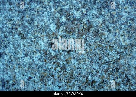 Textur aus poliertem Stein. Glatte Oberfläche der Granitplatte. Abstrakter Hintergrund für Design Stockfoto