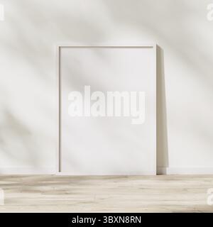 Blank weißer Rahmen, Posterrahmen auf Holzboden mit Sonnenlicht mit Laubschatten an weißer Wand, 3D Rendering Stockfoto
