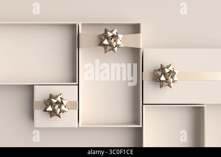 Minimale Zusammensetzung offener, leerer Geschenkboxen mit goldenen Schleifen und Bändern, die darauf warten, auf pastellfarbenem beigem Hintergrund gefüllt zu werden Stockfoto