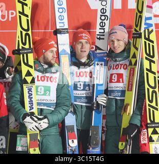 19. Januar 2019: Zakopane, Polen – KARL GEIGER, MARKUS EISENBICHLER, STEPHAN LEYHE feierte nach dem Sieg des Mannschaftswettbewerbs der FIS Skispringen-Weltmeisterschaft in Zakopane. (Foto: © Damian Klamka/ZUMA Wire) Stockfoto