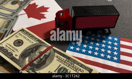 Flaggen und Geld US- und kanadische Dollar. Der Begriff des Handels zwischen Ländern. Gegenseitige finanzielle Beziehungen Stockfoto