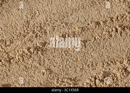 Natürliche Leinsamenmehl-Textur. Gesunder Hintergrund mit Textbereich. Stockfoto