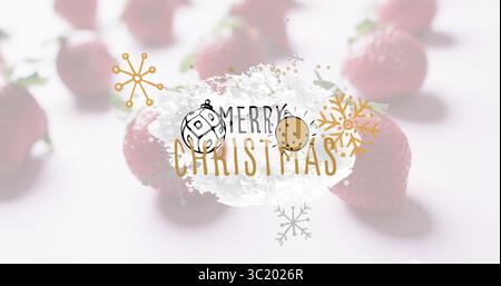 Mit weißem Pinselstrich, der Frohe Christmas-Text auf dem Tisch mit Erdbeeren und Ornamenten trägt Stockfoto