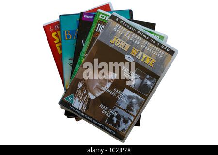 Stapel von DVDs mit Most Wanted Collection John Wayne DVD oben isoliert auf weißem Hintergrund Stockfoto