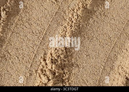 Leinsamenmehl Makrostruktur Draufsicht. Kulinarischer Hintergrund Stockfoto