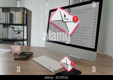 Der Phishing-Mail-Computermonitor zeigt E-Mail-Benachrichtigungen mit Warnsymbolen an, umgeben von Tastatur, Taschenrechner, Sparkasse und einem modernen Schreibtisch Stockfoto