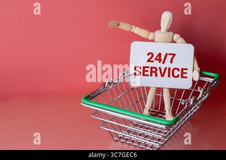 Warenkorb und Karte mit Text 24 7 Service. Stockfoto