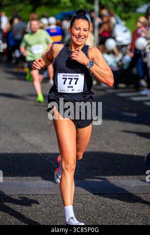 Belfast, Großbritannien. August 2025. 08/2025 Belfast 3000 Menschen haben heute am Feile 5k & 10k Run in West Belfast teilgenommen. Die Rains hielten an einem warmen, schwülen Morgen für die Runners ab. Quelle: Bonzo/Alamy Live News Stockfoto