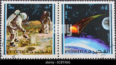 Abgesagte Briefmarke gedruckt von Fujairah, die Weltraumforschung zeigt, um 1971. Stockfoto